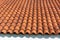 Elegant Roof Design: Red Corrugated Tiles and Textured Shingles Enhancing Building Aesthetics