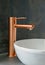 Elegant Rose Gold Faucet Over Modern Sink. Generative ai