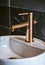 Elegant Rose Gold Faucet Over Modern Sink. Generative ai