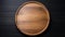 Elegant Round Wooden Tray on a Dark Textured Background, Copy Space