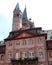 Elegant and simple palace in Mainz behind a bell tower and a large tower in Germany