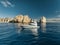 Elegant sportfishing yacht in the ocean in Cabo, Mexico sailing leisurely through a tranquil bay