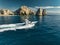 Elegant sportfishing yacht in the ocean in Cabo, Mexico sailing leisurely through a tranquil bay