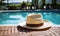 Elegant straw fedora hat resting on a poolside under the tranquil summer sun, symbolizing leisure, vacation, and the serene joy of