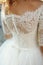 Elegant stylish vintage white wedding dress with ornaments back