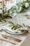 Elegant table setting with olive branch decoration