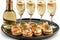 Elegant table setting with prosecco or champagne, smoked salmon canape and copy space