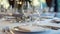 Elegant table setting with wine glasses. Bokeh lighting in upscale restaurant