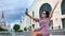 Elegant travel woman taking selfie at city with medieval architecture. 4k Dragon RED camera