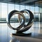 Elegant Unity: Abstract Metal Sculpture Embodying Teamwork on Marble Platform