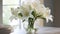 Elegant Verbena Arrangement With Blooming Lilies White Lilies In Clear Vase