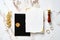 Elegant wedding stationery set. Wedding invitation card mockup, black wedding envelope with wax seal stamp, golden ring, golden