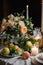 Elegant wedding table decoration with lots of candles and flowers