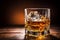 Elegant whiskey glass isolated on a rich brown background with ample copy space for text placement