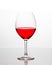 Elegant wineglasses on white background with reflection and vivid colored liquid