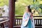 Elegant woman in Chinese traditional drama ancient costume play Chinese lute pipa guitar