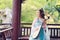 Elegant woman in Chinese traditional drama ancient costume play Chinese lute pipa guitar