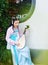 Elegant woman in Chinese traditional hanfu dress play Chinese lute pipa guitar