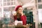 Elegant woman feeling amazing sitting in bakery and looking into window