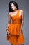 Elegant woman in orange dress