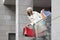 Elegant woman with purchases in hands leaves the mall.