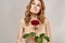 Elegant woman with red rose thorns light background romance flowers