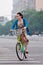Elegant woman rides a public share bike, Beijing, China
