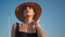 Elegant woman straw hat posing at beautiful blue sky closeup. Portrait chic girl