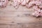 Elegant Wood Texture Background Adorned with Soft Pink Cherry Blossoms