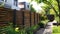 Elegant Wooden Fence Design in a Lush Garden Setting. Generative ai