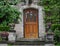 Elegant wooden front door with leaded glass