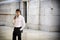 Elegant young businessman outdoor, marble wall and