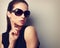 Elegant young female model in trendy sunglasses posing. Vintage
