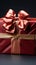 Elegantly adorned: Red gift box, golden ribbon, and exquisite bow.