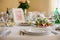 Elegantly catered wedding reception table: glasses, plates and s