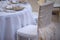 Elegantly covered chair with pearly sequin fabric and beige feathers at a restaurant or formal venue