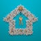 An elegantly decorated Christmas tree wreath in the shape of a symbolic house and the keys to a new home.