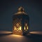 Elegantly decorated square lantern glowing on a dark background. Lantern as a symbol of Ramadan for Muslims