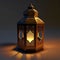 Elegantly decorated square lantern glowing on a dark background. Lantern as a symbol of Ramadan for Muslims