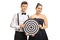 Elegantly dressed teenage couple holding a target