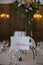 Elegantly served with wedding glasses, cutlery and decorated with flowers tables with white tablecloths and burning candles