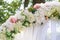 Element wedding arches of white and pink flowers close-up