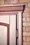 Element of wooden door brown colored carved in classical style o