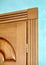 Element of wooden door in frame of brown wood carved geometric o