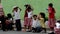 Elementary school children stand in line as they are taught to behave during building fire situation