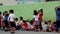 Elementary school children stand in line as they are taught to behave during building fire situation