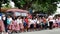 Elementary school children stand in line as they are taught to behave during building fire situation