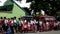 Elementary school children stand in line as they are taught to behave during building fire situation