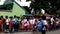 Elementary school children stand in line as they are taught to behave during building fire situation