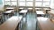 Elementary school interior. Empty school class. School education. Inside school. Students and pupils. Tables and chairs in the cl